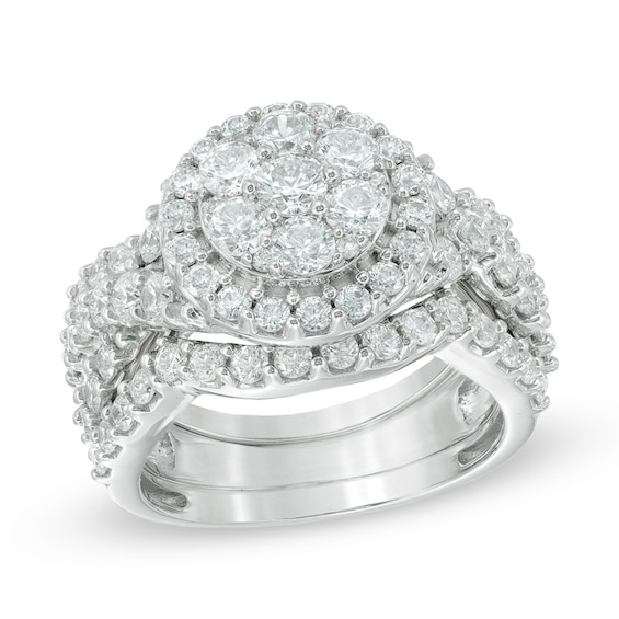 Previously Owned - 2-1/2 CT. T.w. Diamond Cluster Twist Three Piece Bridal Set in 14K White Gold