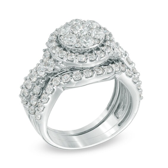 Previously Owned - 2-1/2 CT. T.w. Diamond Cluster Twist Three Piece Bridal Set in 14K White Gold