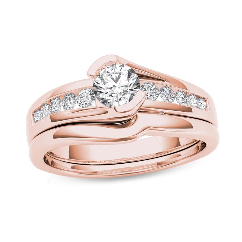 Main Image 1 of Previously Owned - 1/2 CT. T.W. Diamond Bypass Bridal Set in 14K Rose Gold