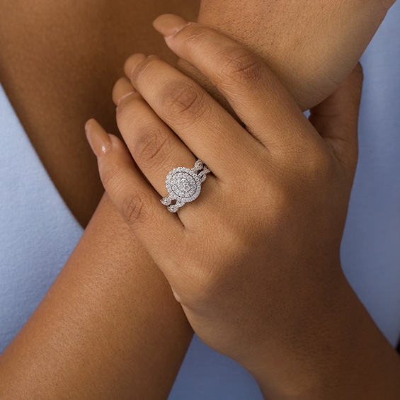 Previously Owned - 3/4 CT. T.w. Composite Diamond Double Oval Frame Twist Bridal Set in 10K White Gold