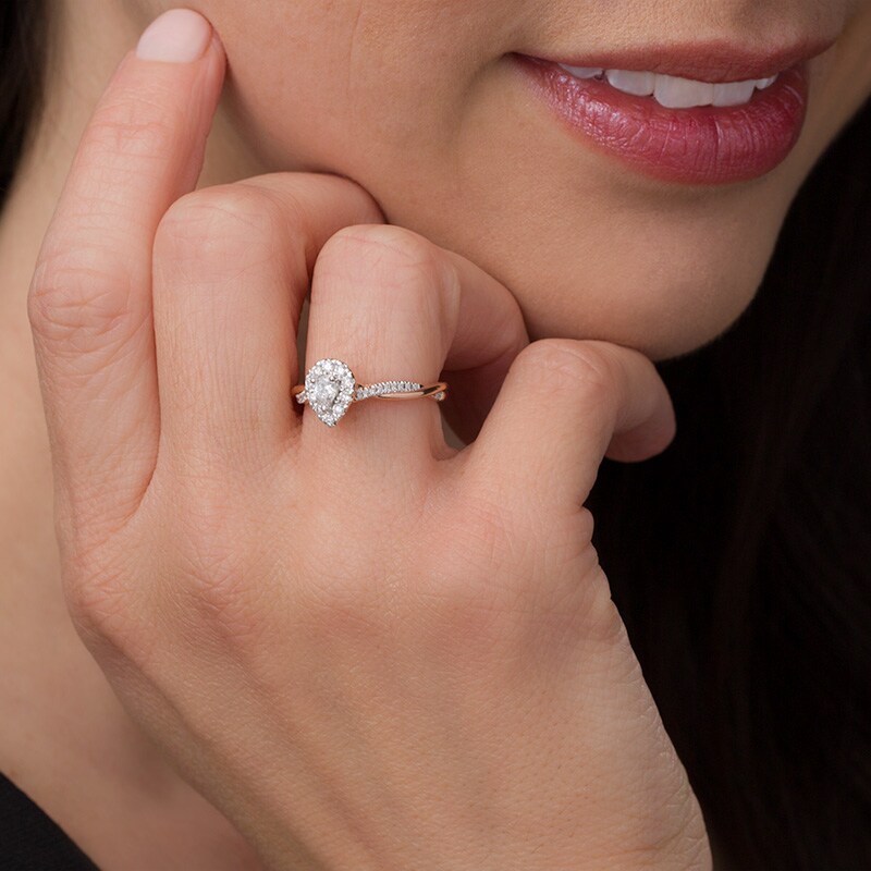 Previously Owned - 3/8 CT. T.W. Pear-Shaped Diamond Frame Twist Engagement in 10K Rose Gold