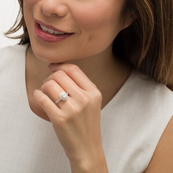 Previously Owned - 1 CT. T.w. Oval Diamond Double Frame Engagement Ring in 14K White Gold