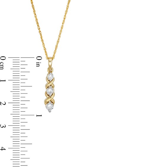 Previously Owned - 1/3 CT. T.w. Diamond Three Stone "Xo" Pendant in 10K Gold