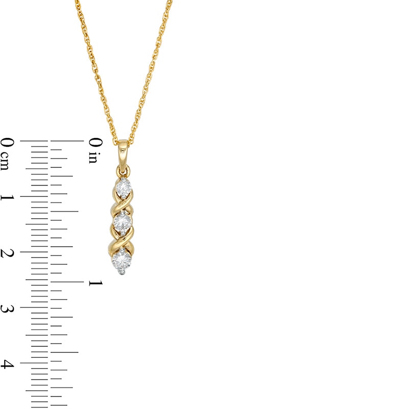 Main Image 3 of Previously Owned - 1/3 CT. T.W. Diamond Three Stone "XO" Pendant in 10K Gold