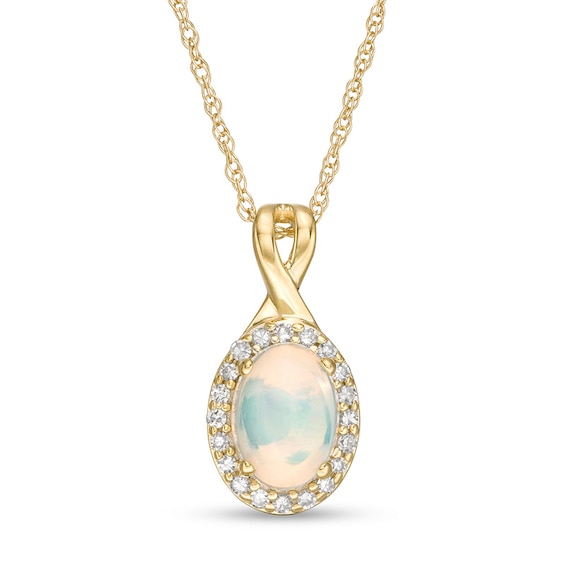 Previously Owned - Oval Opal and 1/15 CT. T.w. Diamond Frame Pendant in 10K Gold