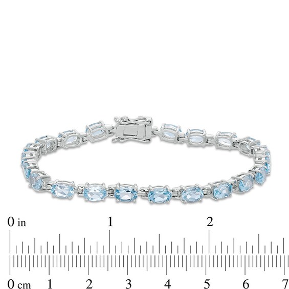 Previously Owned - Sideways Oval Blue Topaz Tennis Bracelet in Sterling Silver - 7.5"