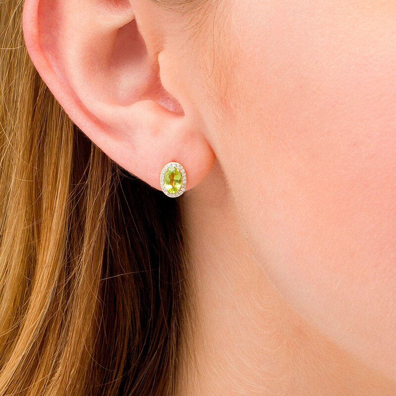 Main Image 2 of Previously Owned - Oval Peridot and 1/10 CT. T.W. Diamond Frame Stud Earrings in 10K Gold