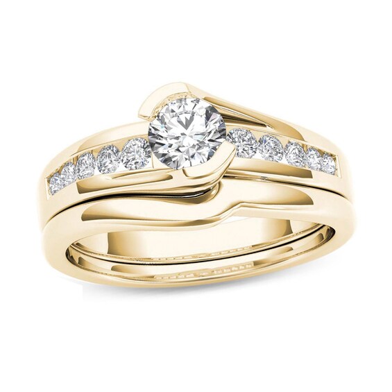 Previously Owned - 1/2 CT. T.w. Diamond Bypass Bridal Set in 14K Gold
