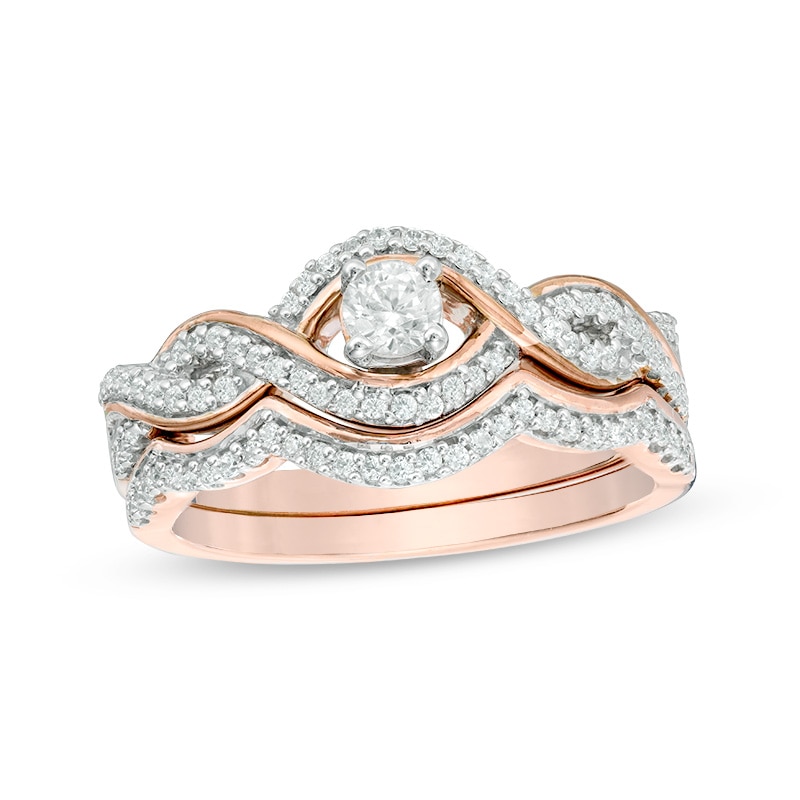 Main Image 1 of Previously Owned - 1/2 CT. T.W. Diamond Bypass Frame Twist Bridal Set in 10K Rose Gold