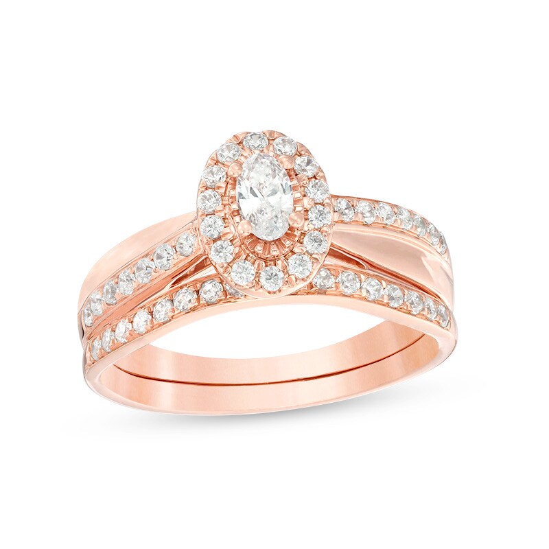 Main Image 1 of Previously Owned - 3/4 CT. T.W. Oval Diamond Frame Crossover Bridal Set in 14K Rose Gold
