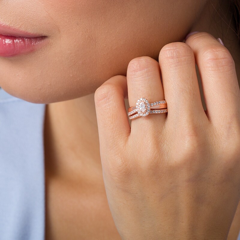 Main Image 2 of Previously Owned - 3/4 CT. T.W. Oval Diamond Frame Crossover Bridal Set in 14K Rose Gold