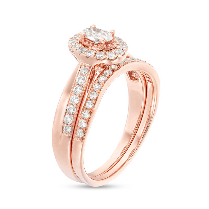 Main Image 3 of Previously Owned - 3/4 CT. T.W. Oval Diamond Frame Crossover Bridal Set in 14K Rose Gold