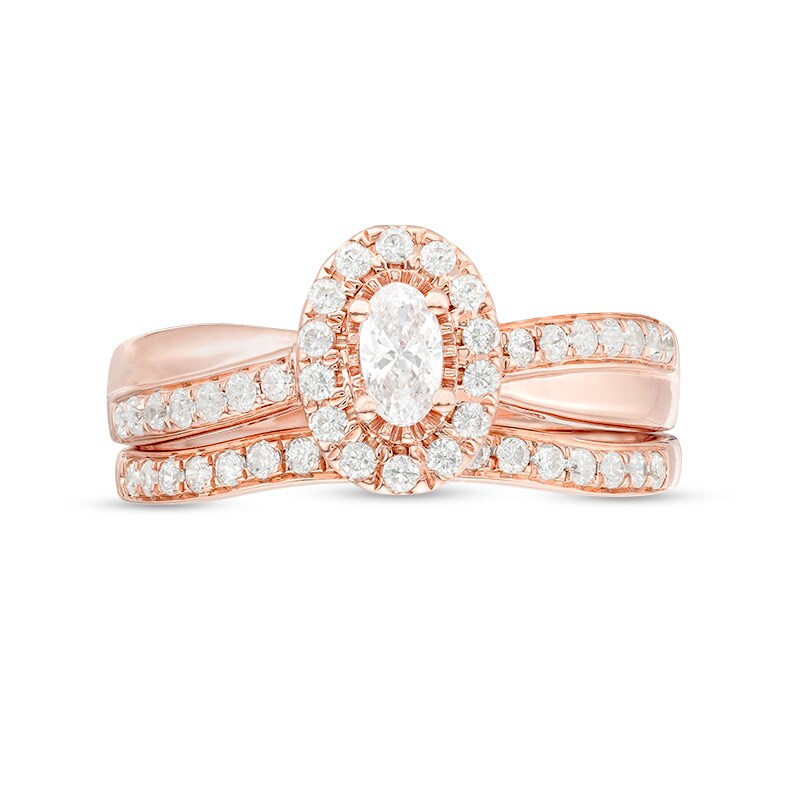 Main Image 4 of Previously Owned - 3/4 CT. T.W. Oval Diamond Frame Crossover Bridal Set in 14K Rose Gold