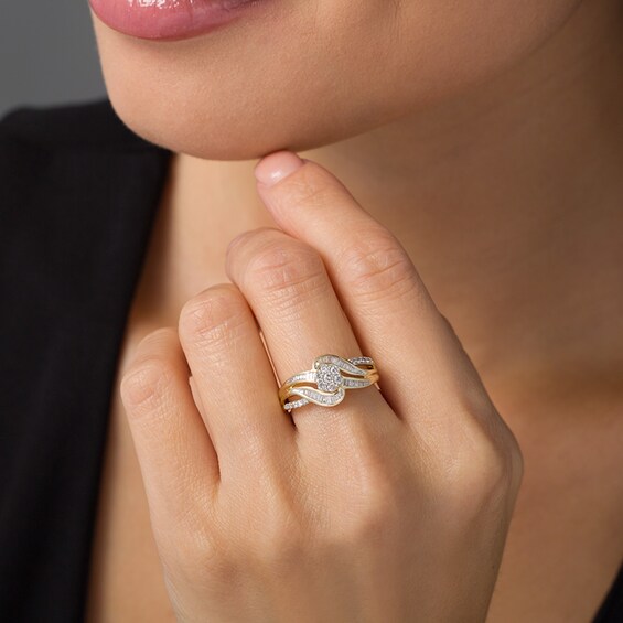 Previously Owned - 1/2 CT. T.w. Baguette and Round Composite Diamond Bypass Ring in 10K Gold