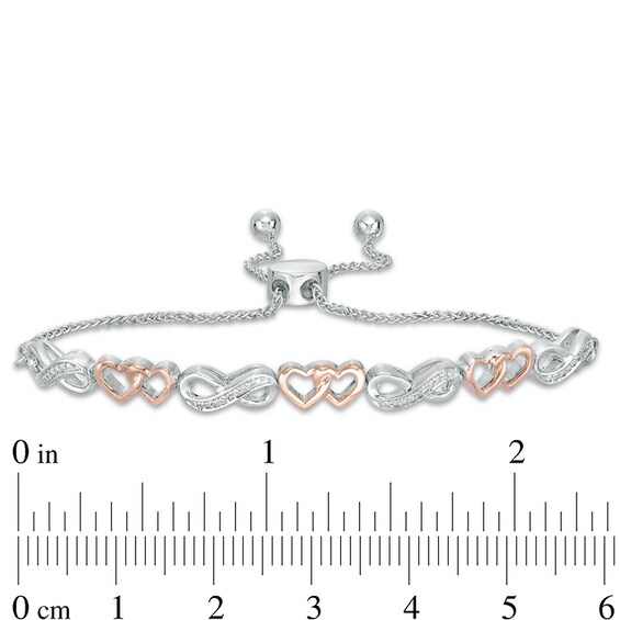 Previously Owned - 1/20 CT. T.w. Diamond Heart Infinity Bolo Bracelet in Sterling Silver and 10K Rose Gold - 9.5"
