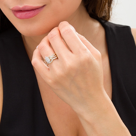 Previously Owned - 5/8 CT. T.w. Marquise Diamond Frame Wedding Ensemble in 10K Two-Tone Gold - Size 7 and 10