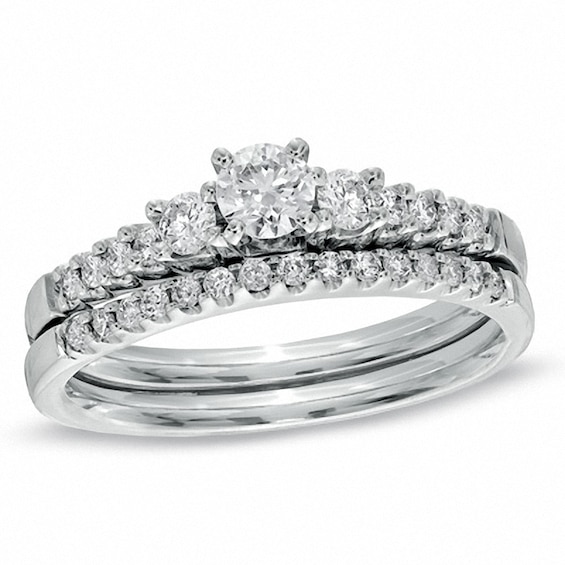 Previously Owned - 5/8 CT. T.w. Diamond Three Stone Bridal Set in 14K White Gold