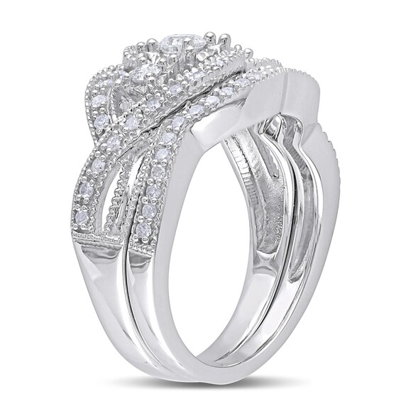 Previously Owned - 1/2 CT. T.w. Diamond Three Stone Knot Bridal Set in Sterling Silver