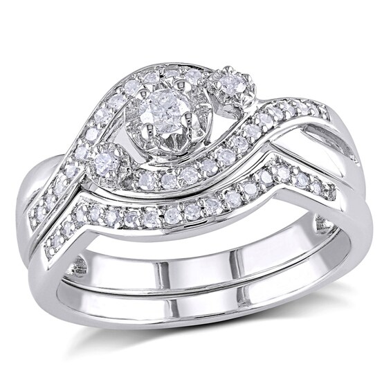 Previously Owned - 1/3 CT. T.w. Diamond Three Stone Slant Bridal Set in Sterling Silver