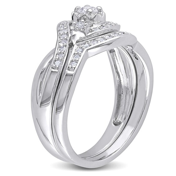 Previously Owned - 1/3 CT. T.w. Diamond Three Stone Slant Bridal Set in Sterling Silver