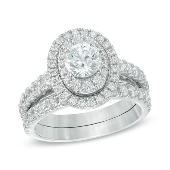 Previously Owned - 2 CT. T.w. Diamond Oval Frame Bridal Set in 14K White Gold
