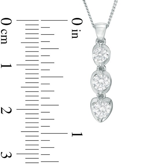 Previously Owned - 1/2 CT. T.w. Diamond Three Stone Tension-Set Pendant in 14K White Gold (I/I2) - 17"