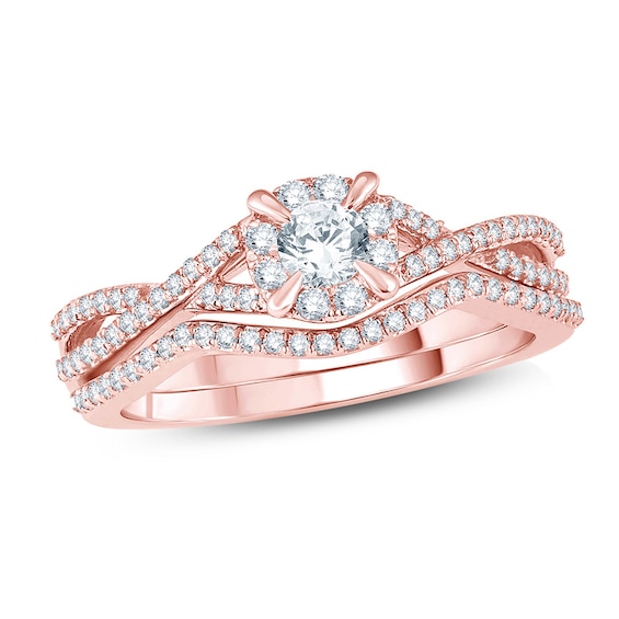 Previously Owned - 1/2 CT. T.w. Diamond Frame Twist Bridal Set in 14K Rose Gold