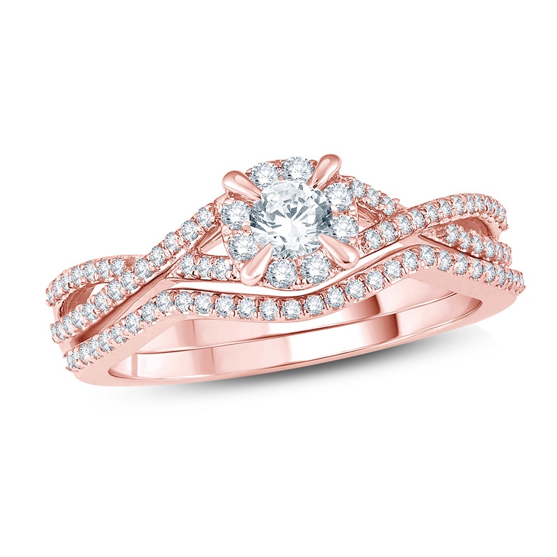 Main Image 1 of Previously Owned - 1/2 CT. T.W. Diamond Frame Twist Bridal Set in 14K Rose Gold