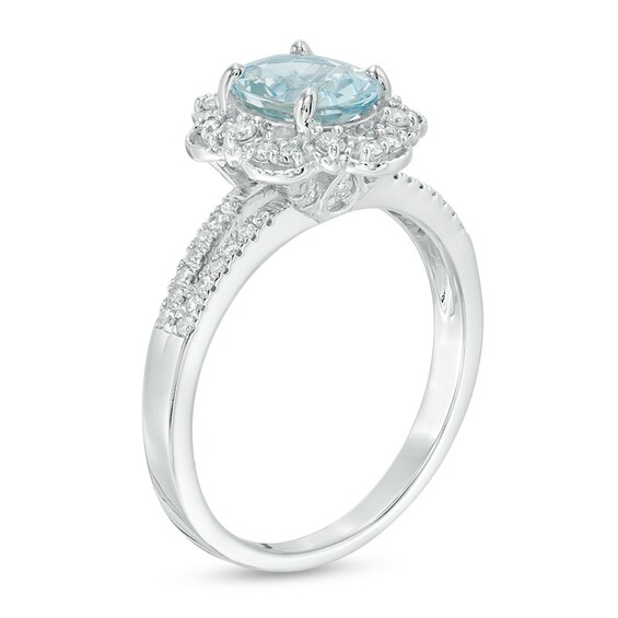 Previously Owned - Oval Aquamarine and 1/4 CT. T.w. Diamond Flower Frame Vintage-Style Ring in 14K White Gold