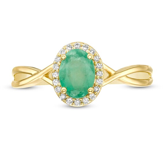 Previously Owned - Oval Emerald and 1/15 CT. T.w. Diamond Frame Twist Shank Ring in 10K Gold