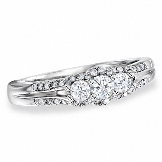 Previously Owned - 1/2 CT. T.w. Diamond Pavé Three Stone Framed Ring in 10K White Gold