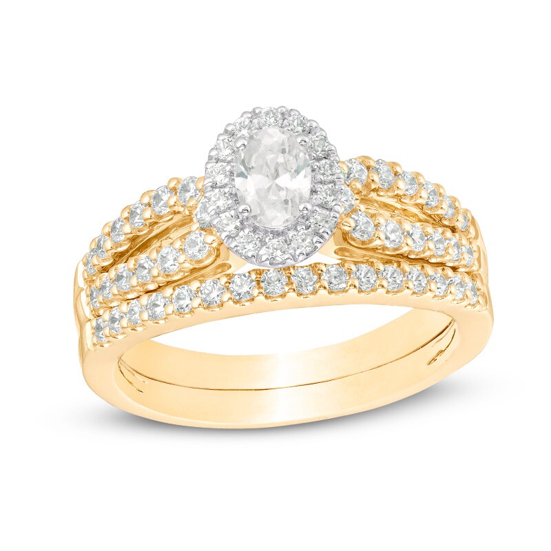Main Image 1 of Previously Owned - 1 CT. T.W. Oval Diamond Frame Split Shank Bridal Set in 14K Gold (I/I1)