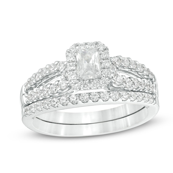 Previously Owned - 1 CT. T.w. Emerald-Cut Diamond Frame Split Shank Bridal Set in 14K White Gold (I/I1)