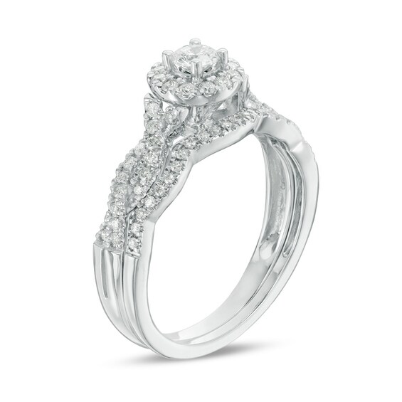 Previously Owned - 1/2 CT. T.w. Diamond Frame Twist Bridal Set in 10K White Gold