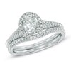 Thumbnail Image 1 of Previously Owned - 1-1/6 CT. T.W. Oval Diamond Frame Bridal Set in 14K White Gold