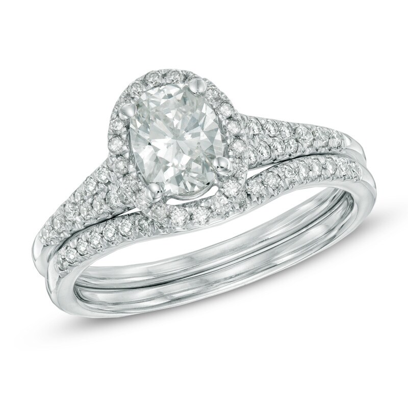 Main Image 1 of Previously Owned - 1-1/6 CT. T.W. Oval Diamond Frame Bridal Set in 14K White Gold