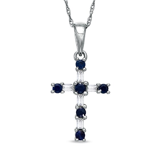 Previously Owned - Blue Sapphire and 1/10 CT. T.w. Baguette Diamond Cross Pendant in 10K White Gold