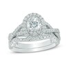 Thumbnail Image 1 of Previously Owned - 1-1/2 CT. T.W. Diamond Oval Frame Twist Bridal Set in 14K White Gold