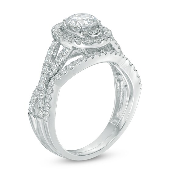 Previously Owned - 1-1/2 CT. T.w. Diamond Oval Frame Twist Bridal Set in 14K White Gold
