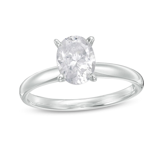 Previously Owned - 1 CT. T.w. Oval Diamond Solitaire Engagement Ring in 14K White Gold (I/I2)