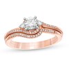 Thumbnail Image 1 of Previously Owned 1/4 CT. T.W. Diamond Bypass Three Stone Soldered Bridal Set in 10K Rose Gold