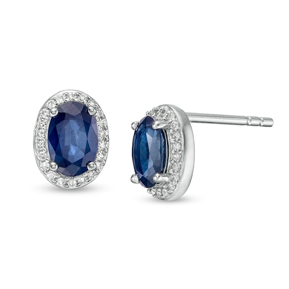 Previously Owned - Oval Blue Sapphire and 1/10 CT. T.w. Diamond Frame Stud Earrings in 10K White Gold