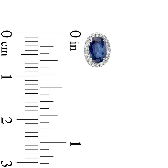 Previously Owned - Oval Blue Sapphire and 1/10 CT. T.w. Diamond Frame Stud Earrings in 10K White Gold