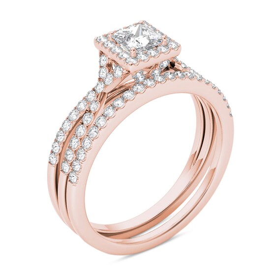 Previously Owned - 1 CT. T.w. Princess-Cut Diamond Frame Twist Bridal Set in 14K Rose Gold