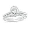 Thumbnail Image 1 of Previously Owned - 5/8 CT. T.W. Oval Diamond Frame Bridal Set in 14K White Gold