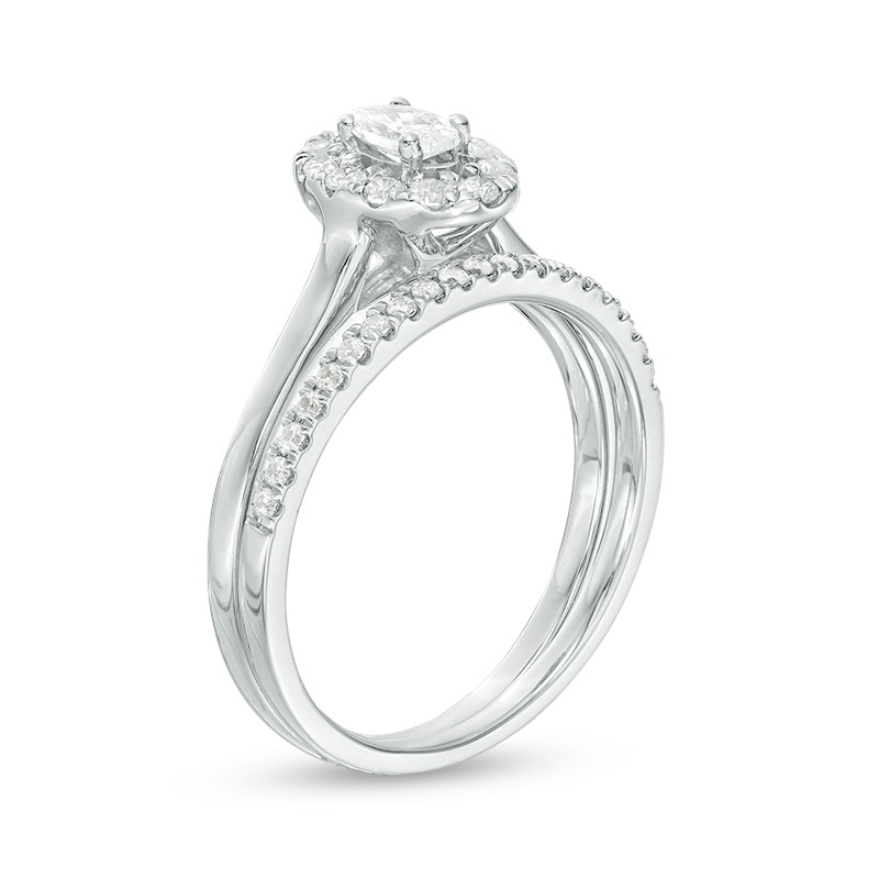 Main Image 3 of Previously Owned - 5/8 CT. T.W. Oval Diamond Frame Bridal Set in 14K White Gold