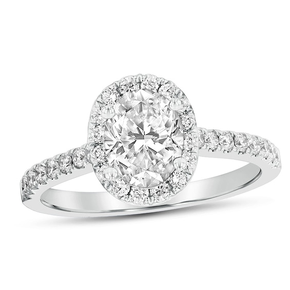 Previously Owned - 1 CT. T.w. Oval Diamond Frame Engagement Ring in Platinum (G/Si2)