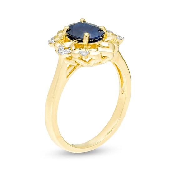 Previously Owned - Oval Blue Sapphire and 1/20 CT. T.w. Diamond Ornate Ring in 10K Gold