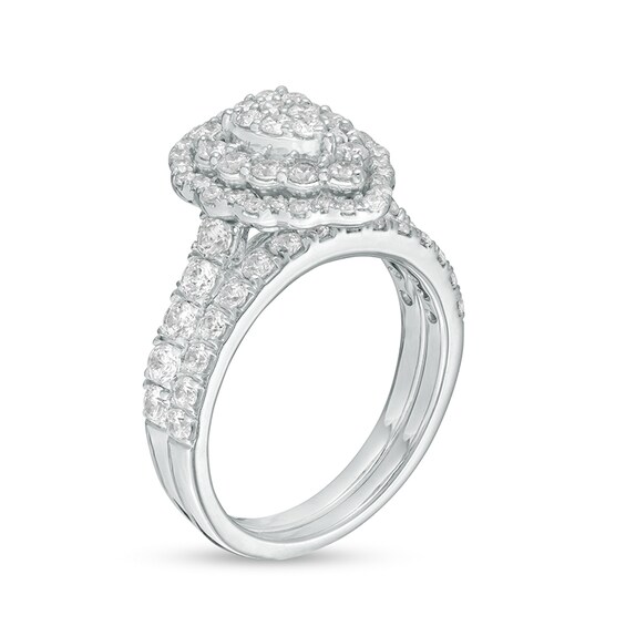 Previously Owned - 1-1/2 CT. T.w. Multi-Diamond Pear Diamond Scallop Frame Bridal Set in 10K White Gold