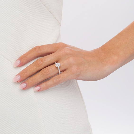 Previously Owned - 1 CT. T.w. Oval Diamond Frame Engagement Ring in 14K White Gold (I/I2)
